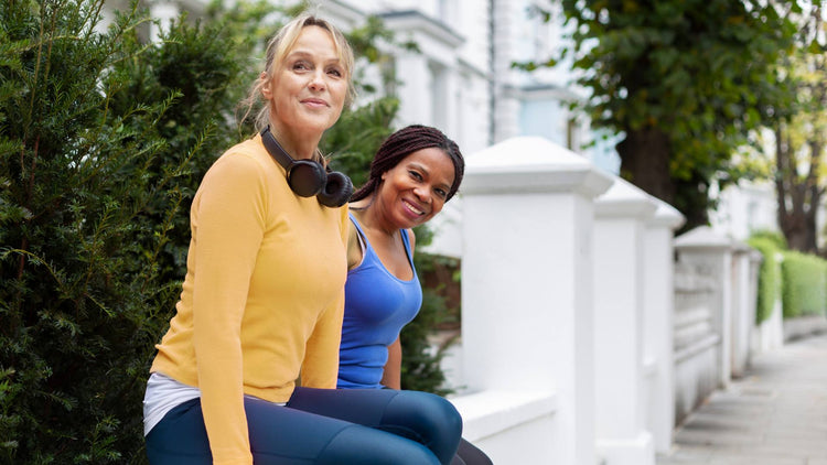 Two women smiling outdoors, representing wellness and vitality; DNA Biopharm - The Good Stuff product image.