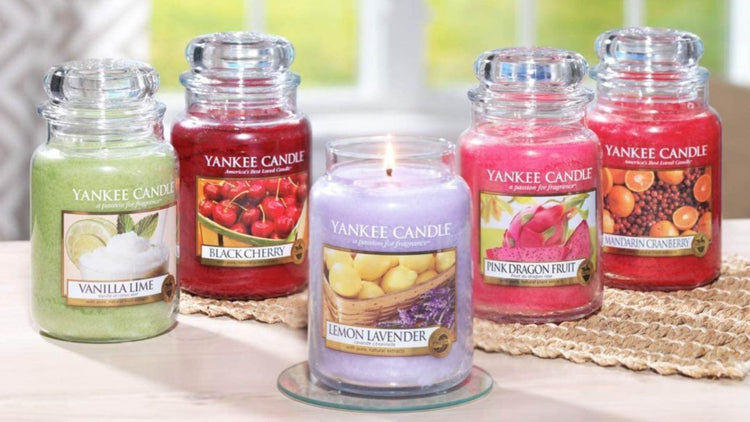 Yankee Candle collection with scents including Vanilla Lime, Black Cherry, Lemon Lavender, Pink Dragon Fruit, and Mandarin Cranberry on display.